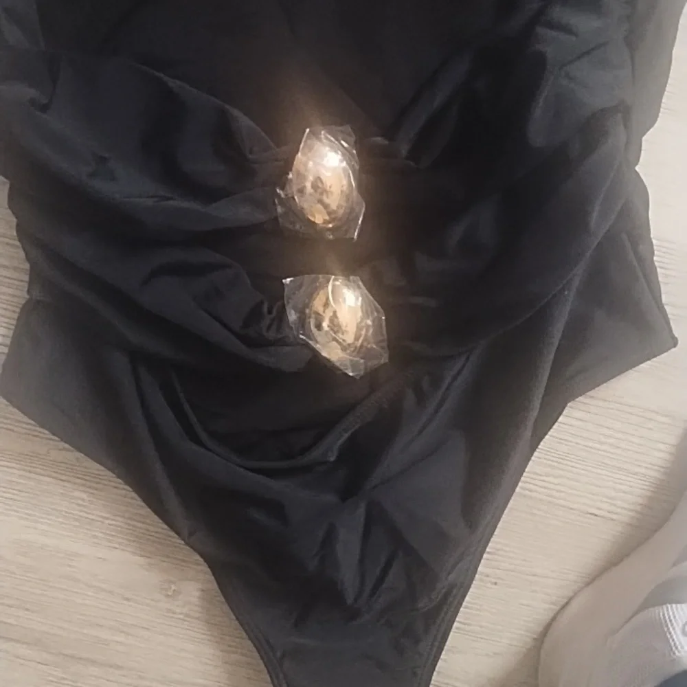 Elegant Black One-Piece Swimsuit with Gold Accents - Picture 4 of 5